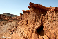 Lugga Running through the Red Cliff of the Lothagam Mountains. Turkana, Kenya